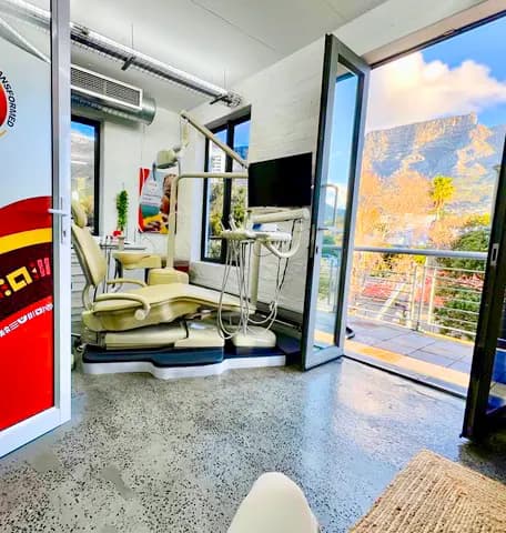 Cape Town surgery with Table Mountain through open doors
