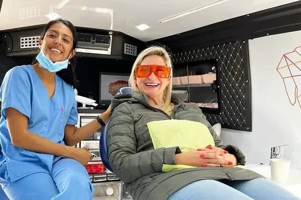 Inside the Mia mobile clinic van, a clinician with a patient