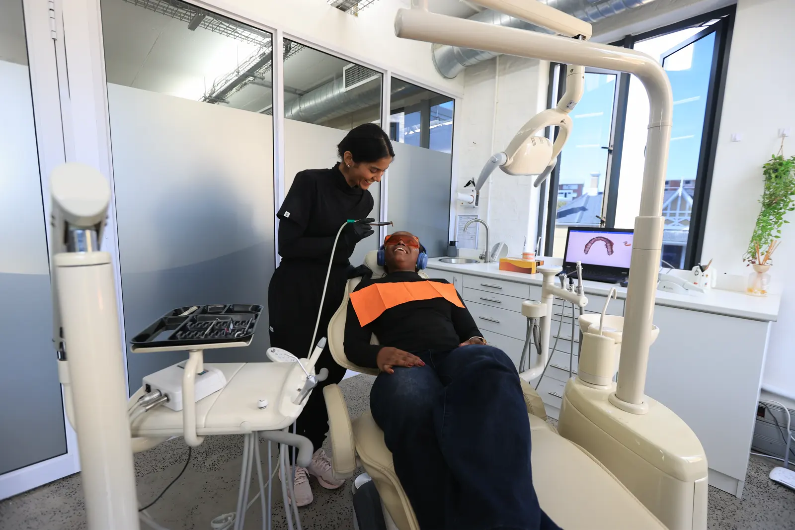 Dentist treating a patient in the Mia Cape Town surgery